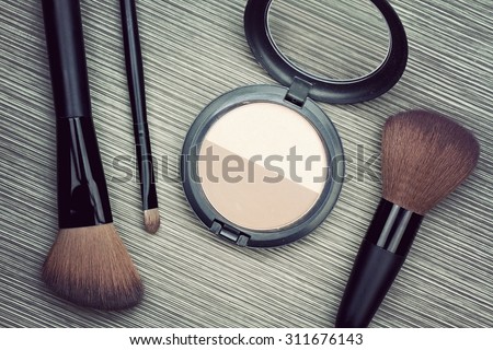A bunch of make-up brushes and Cosmetics, Set of makeup brush and contour palette, Women accessories. (Vintage Style Color)