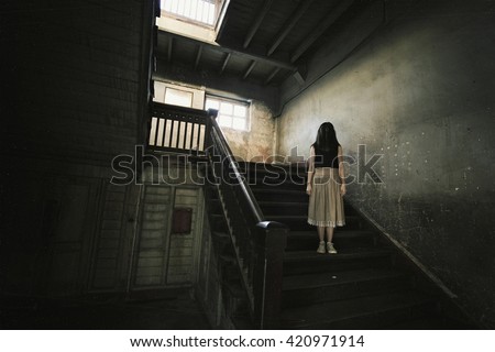 Ghost in Haunted House, Mysterious Woman, Horror scene of scary woman\'s ghost.(Vintage Film Style Process)