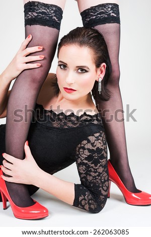 Portrait of the beautiful woman, who  is holding somebody legs