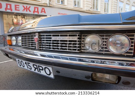 MOSCOW, RUSSIA - July 26, 2014 : Soviet car Chaika GAZ-14 retro rally Gorkyclassic, near Gum Department store, Moscow, lights closeup