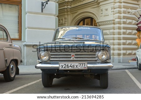 MOSCOW, RUSSIA - July 26, 2014: Soviet car Moskvich-408 on retro rally Gorkyclassic about the GUM Department store, Moscow