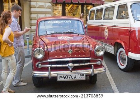 MOSCOW, RUSSIA - July 26, 2014:  Soviet retro car Moskvich-407 on retro rally Gorkyclassic in the Parking lot near Gum Department store, Moscow, front view