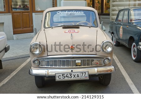 MOSCOW, RUSSIA - July 26, 2014:  Soviet retro car Moskvich-403 on retro rally Gorkyclassic in the Parking lot near Gum Department store, Moscow, front view