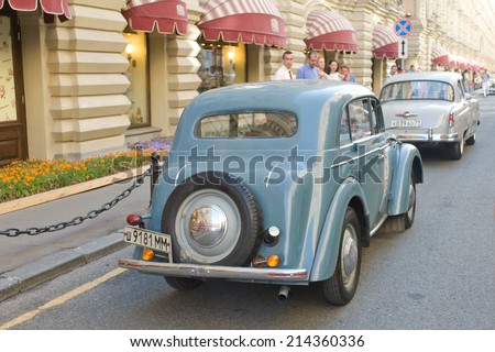 MOSCOW, RUSSIA - July 26, 2014:  Soviet car Moskvich-401 in motion on retro rally Gorkyclassic about Gum, Moscow, rear view