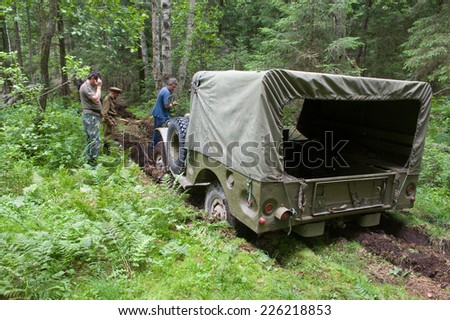 CHERNOGOLOVKA, MOSCOW REGION, RUSSIA-JUNE 21,2013: Old military retro car Dodge WC-51 stuck in the woods,3rd international meeting 