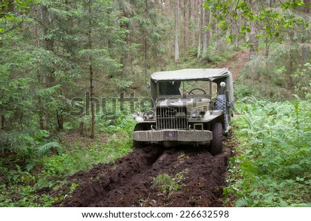 CHERNOGOLOVKA, MOSCOW REGION, RUSSIA-JUNE 21, 2013:  American retro car Dodge WC-51 stuck in the woods, 3rd international meeting \