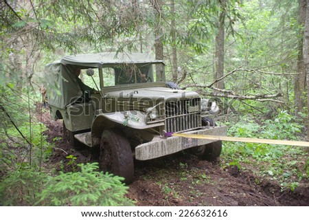 CHERNOGOLOVKA, MOSCOW REGION, RUSSIA-JUNE 21, 2013: U.S. army Dodge WC-51 stuck in the woods on a heavy road, 3rd international meeting \