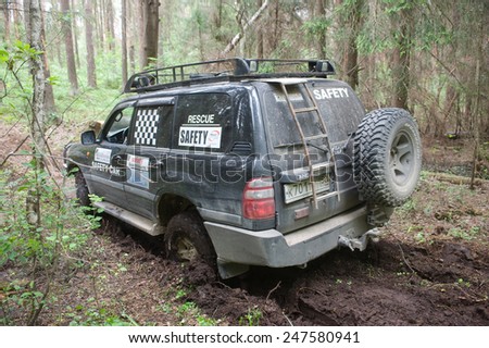 CHERNOGOLOVKA, MOSCOW REGION, RUSSIA - JUNE 21, 2013: The car Toyota Land Cruiser stuck on a forest road,  3rd international meeting \