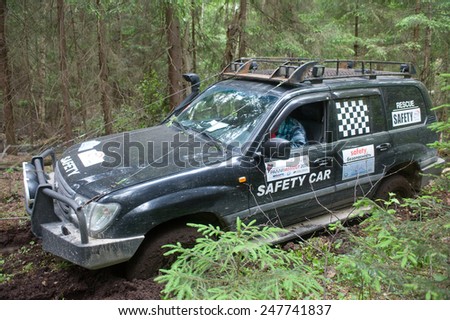 CHERNOGOLOVKA, MOSCOW REGION, RUSSIA - JUNE 21, 2013: Off-road vehicle Toyota Land Cruiser on a forest road,  3rd international meeting \