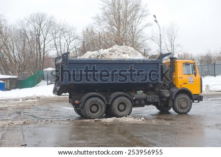 MOSCOW, RUSSIA - February 13, 2015: Yellow dump truck MAZ about negotable on snow-melting point, Moscow