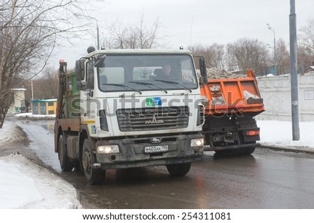 MOSCOW, RUSSIA - February 13, 2015: White truck moving melting snow, Moscow
