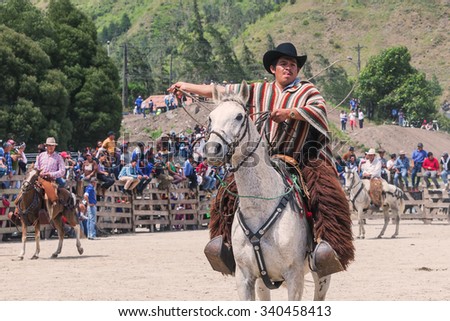 Banos, Ecuador - 30 November 2014: Young Latin Cowboy Is Riding A Horse, Public Demonstration In South America In Banos On November 30, 2014