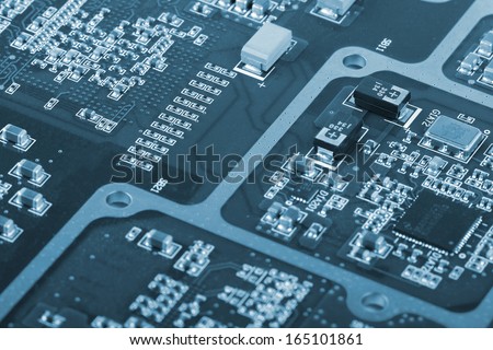 Application Specific Integrated Circuit, inductors, chip capacitors,and chip resistors mounted on a Printed Wiring Board