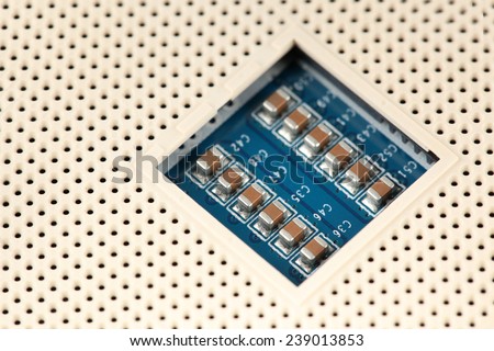 two rows of Chip Capacitors mounted in a socket array through Surface Mount Technology for large Scale Integrated Circuits mounted on a printed wiring board