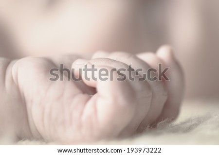 Close up of baby girls' sweet little hand and fingers
