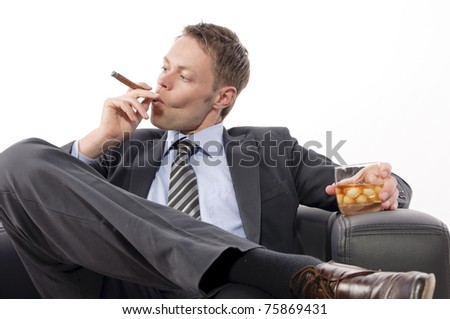 ماذا نسمي هذا ؟ Stock-photo-young-businessman-in-suit-and-tie-sitting-at-a-desk-and-enjoy-a-good-cigar-from-his-humidor-75869431