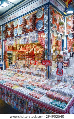 Budapest, Hungary- 27 June, 2014 : People shopping in Great Market Hall for souvenir. Hungarian Paprika, ceramic dish, handicraft embroidery, lace, easter egg,vegetables fruit, jar pickled.
