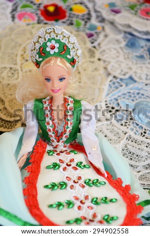Budapest, Hungary- 27 June, 2014: Traditional magyar dolls puppets in folk costume(traditional Hungarian clothing) in Budapest Great Market. Close up, girl in green and red traditional embroidery.