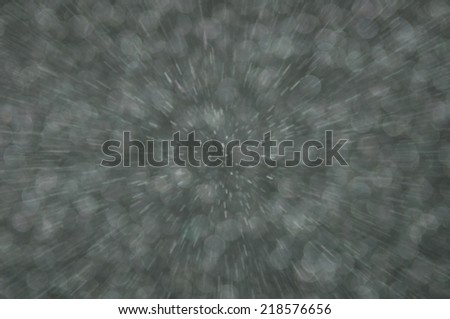 grey abstract explosion with defocused lights background