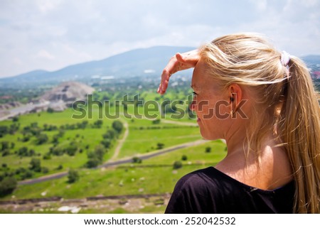 happy young woman looking far away distance