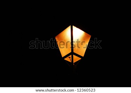 One old orange lamp torch at night