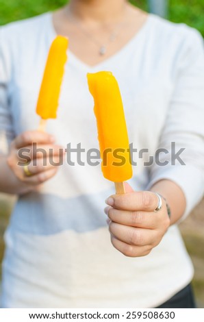 Women share colorful ice lolly
