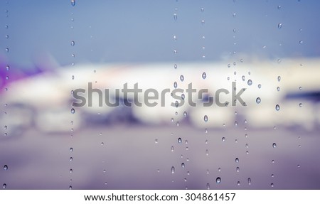 Blurry raining window in airplane (vintage)