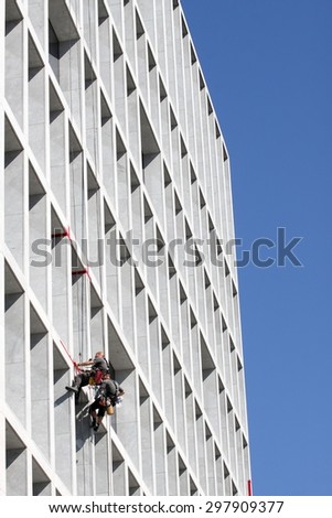 Industrial climber working on the office building
