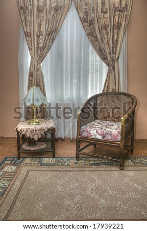 Small table and wicker sofa