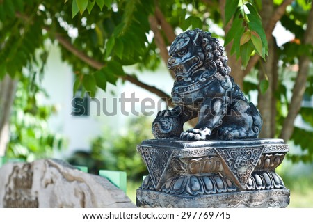 Lion statue on gate to protect house
