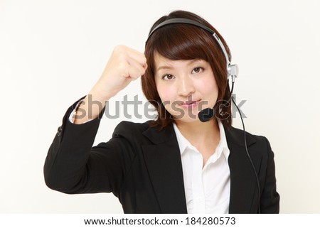 businesswoman of call center in a victory pose