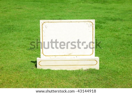 blank stone board on a lawn