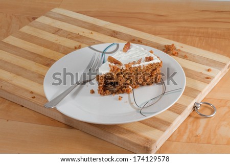 Slice of carrot cake on desert plate with cake fork