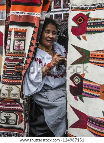 OTAVALO, AUGUST 4, 2012: Indian women in national clothes sells the products of her weaving, as usual on weekdays on the most famous markets in South America, on August 4, 2012 in Otavalo, Ecuador