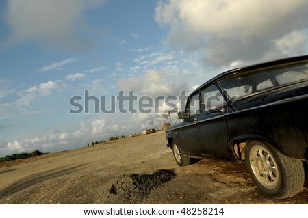 stock photo Old and rusty car left out in the desert