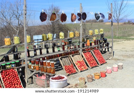 Roadside food stand in Azerbaijan selling fruit, pickles and homemade fruit leather
