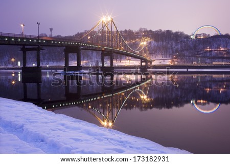 Evening view to Pedestrian bridge and Arc of a friendship of a nations in Kiev