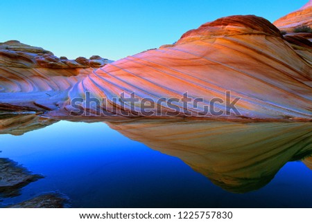 Sandstone Prism 4 (variation).  Water and quartz in rock bend light to create colors of rainbow.  Vermilion Cliffs National Monument.  Arizona, Utah border.  U.S.A.