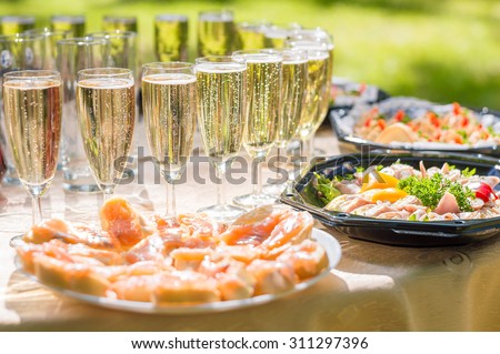 Wedding party buffet with champagne, canape, sandwiches