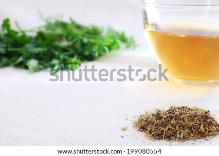 Herbal tea with green herbal leaf  and mixture of dried herbs