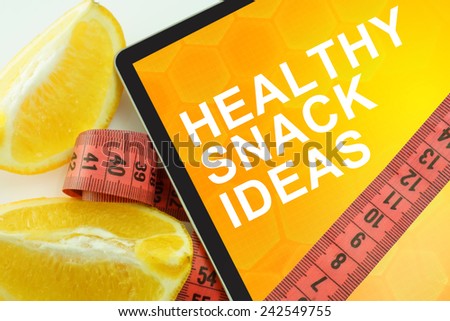 Tablet with words healthy snack ideas and measuring tape