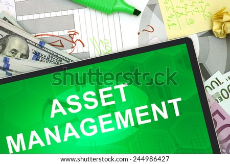 Tablet with words asset management with dollars and euro. management concept