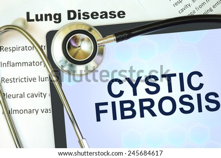 Tablet with words Cystic fibrosis and stethoscope.