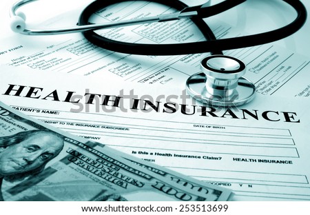 Health insurance form with dollars and stethoscope concept for life planning