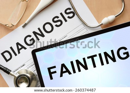 Tablet with diagnosis Fainting  and stethoscope.