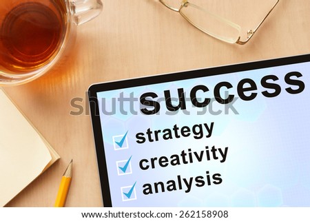 Tablet with words  success path . Business concept.