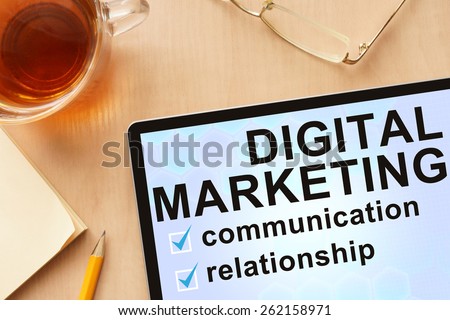Tablet with words digital marketing. Business concept.