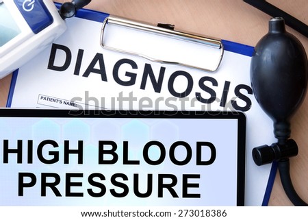 Tablet with  high blood pressure, form with word diagnosis and blood pressure meter