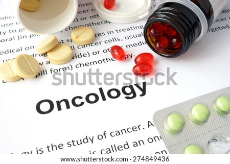 Paper with Oncology and pills. Medical concept.