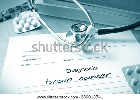 Diagnostic form with diagnosis brain cancer and pills.